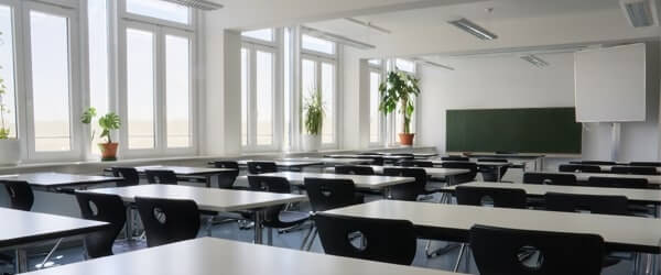 Large empty classroom filled with natural light