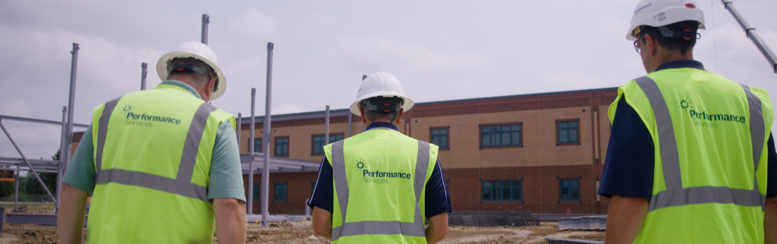 Performance Services team members in proper PPE at a school project site
