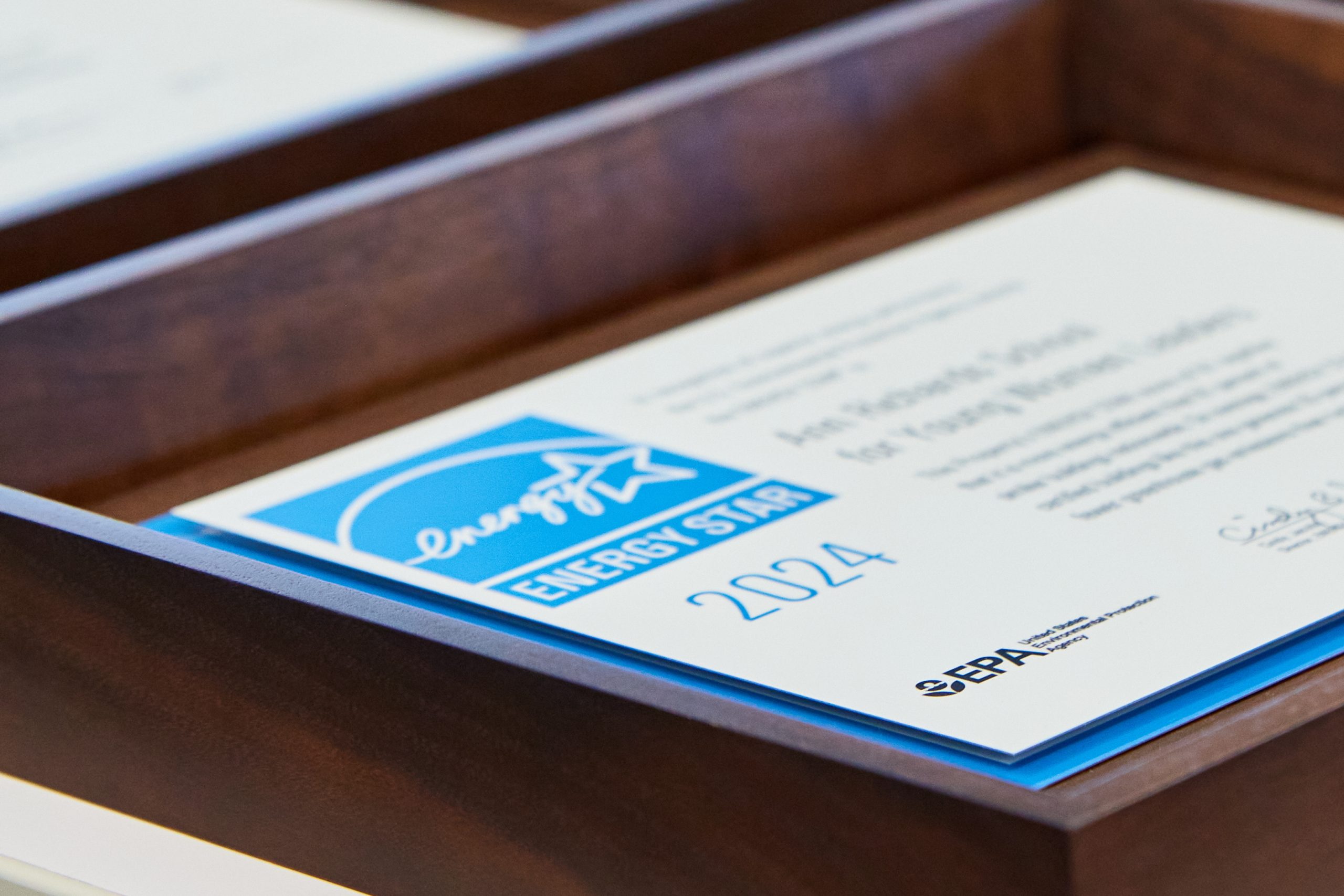 Closeup of an Energy Star award in a wooden frame