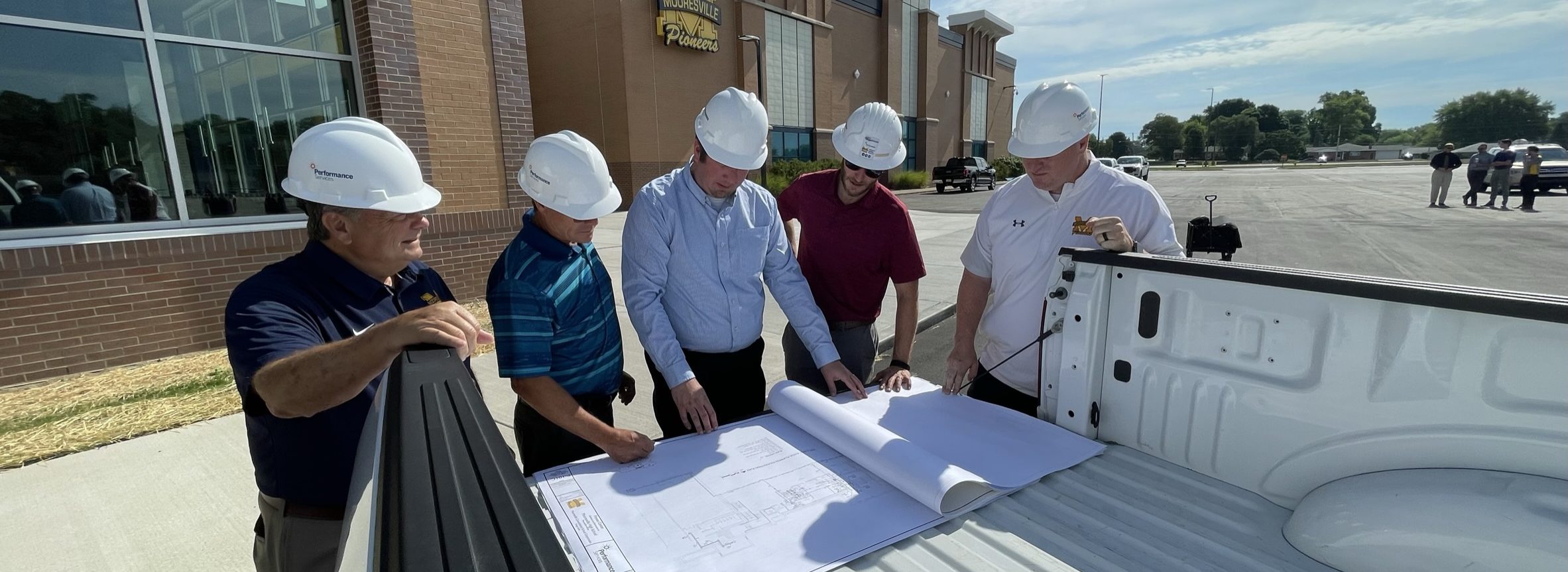 Performance Services team reviewing plans at a jobsite