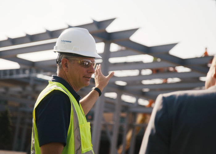 Performance Services team member in PPE on a construction site