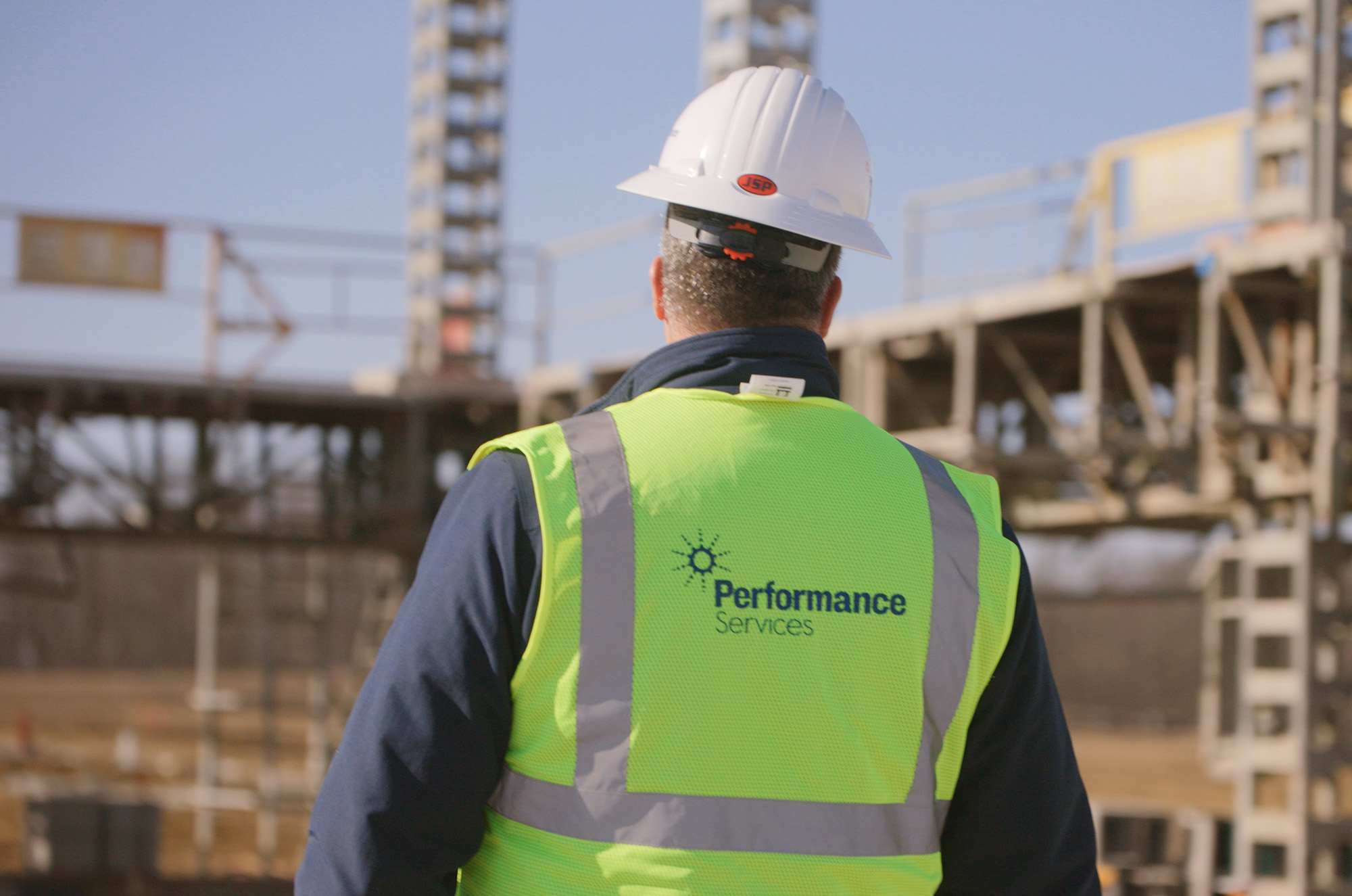 Man with Performance Services Construction Gear on Active Building Site