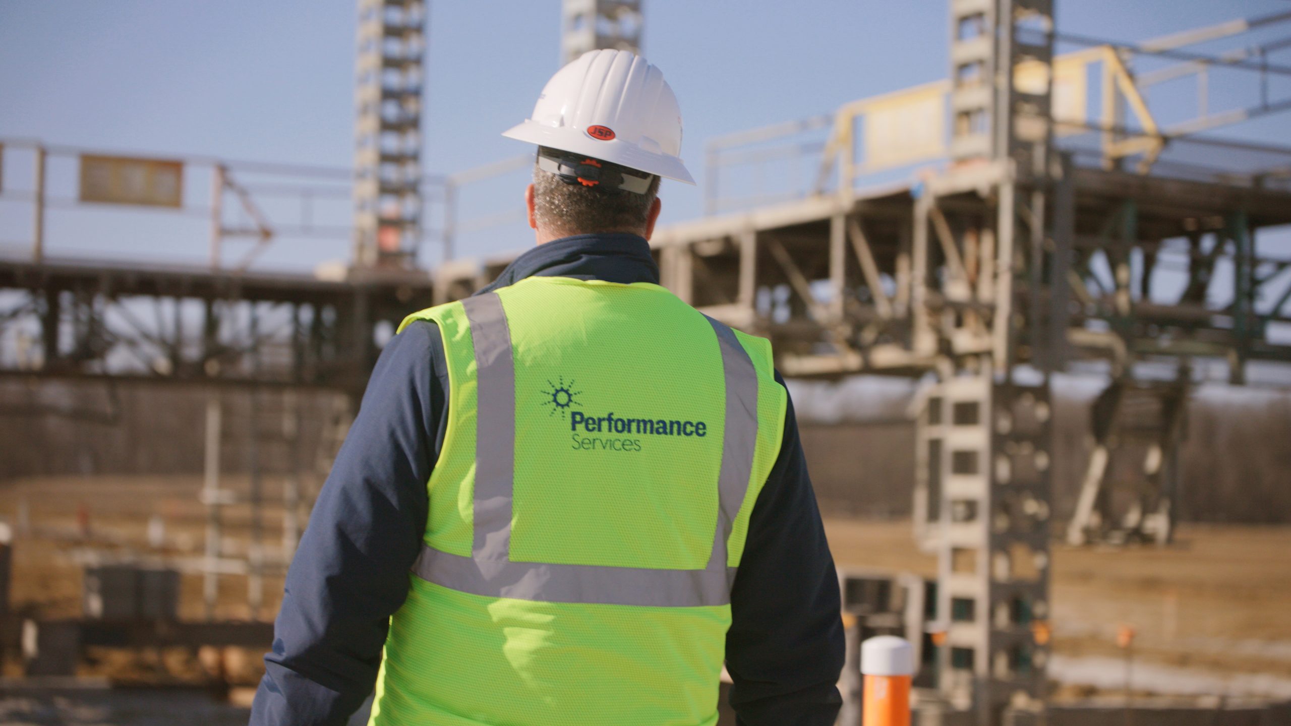 Man with Performance Services Construction Gear on Active Building Site
