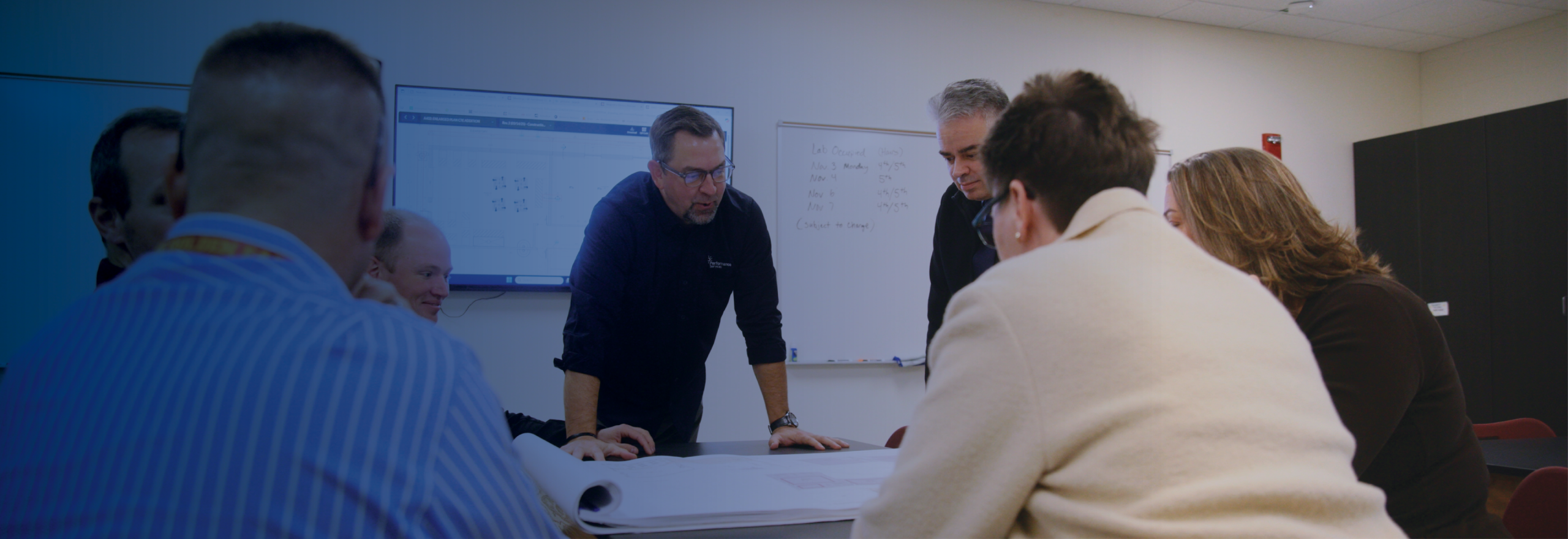 Performance Services team discussing project plans with a k-12 school customer