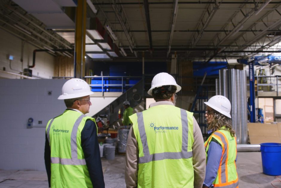 Performance Services team members on a jobsite wearing proper PPE
