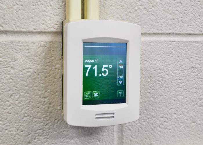 Closeup of indoor temperature controls at a school