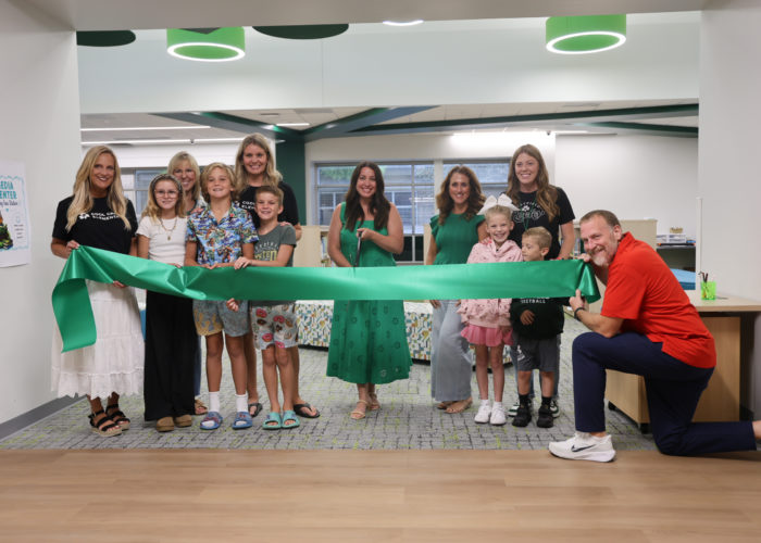 Staff and students of Cool Creek Elementary School cut the ribbon at the grand opening ceremony