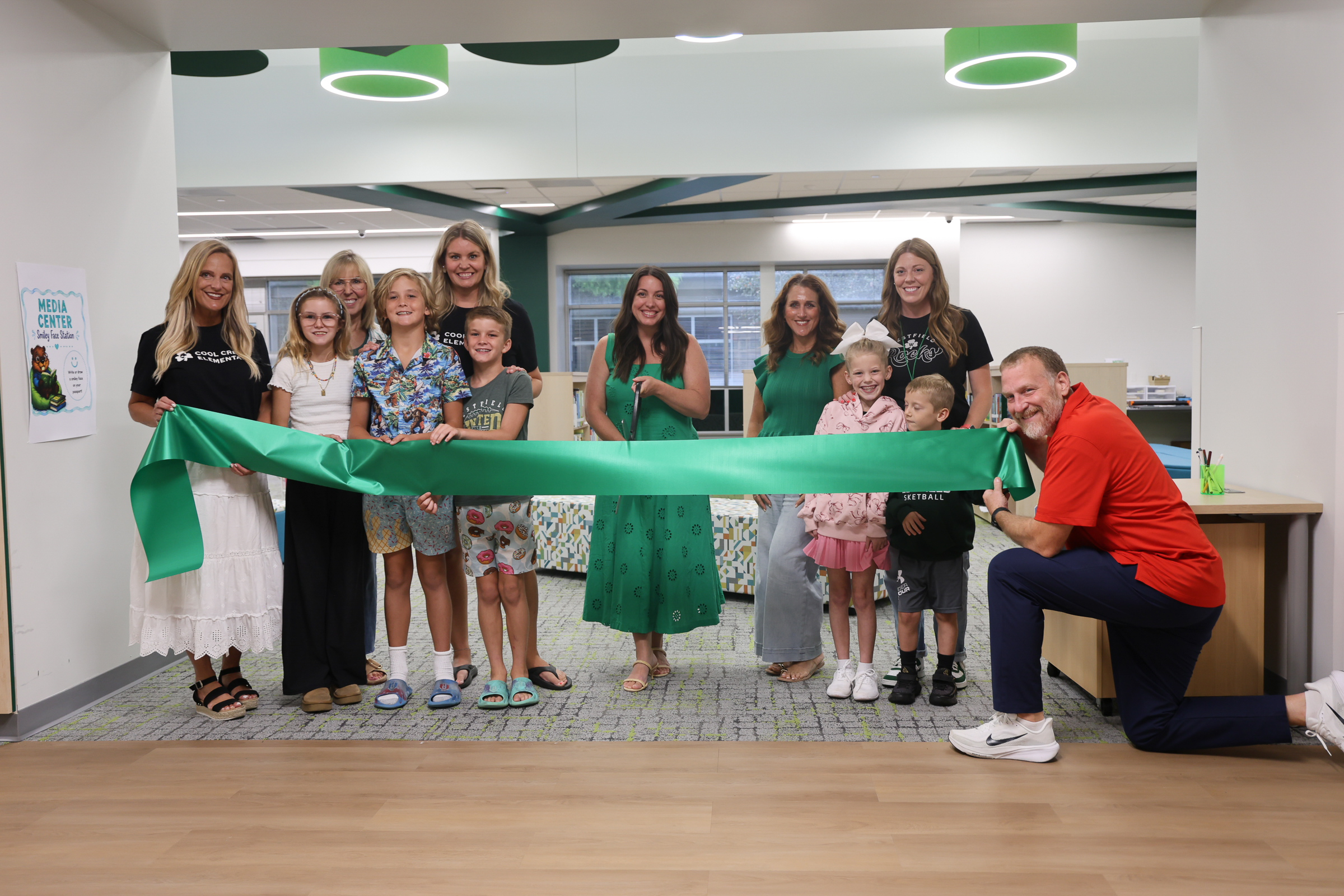 Staff and students of Cool Creek Elementary School cut the ribbon at the grand opening ceremony
