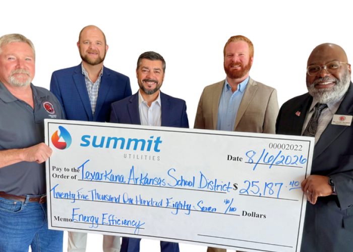 Texarkana Arkansas School Leaders Receiving Rebate Check from Summit Utilities Energy Efficiency Program